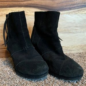 Women’s Toms black leather wedge booties.